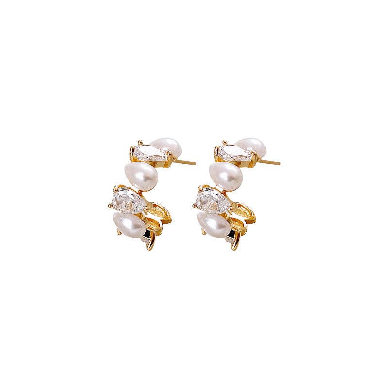 Stud earrings featuring freshwater pearls and pear-cut crystals in an elegant clustered design.