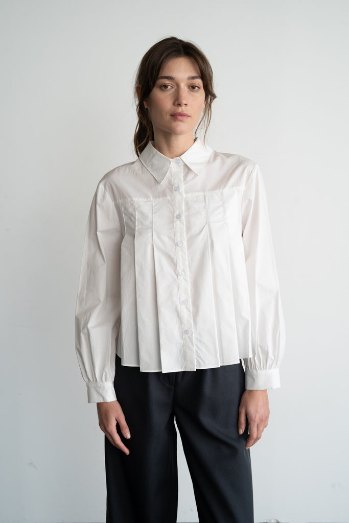 white pleated blouse, cotton poplin shirt, women’s button down top, structured blouse, classic white shirt, Whim top, elevated basics, tailored shirt, modern workwear, minimalist fashion