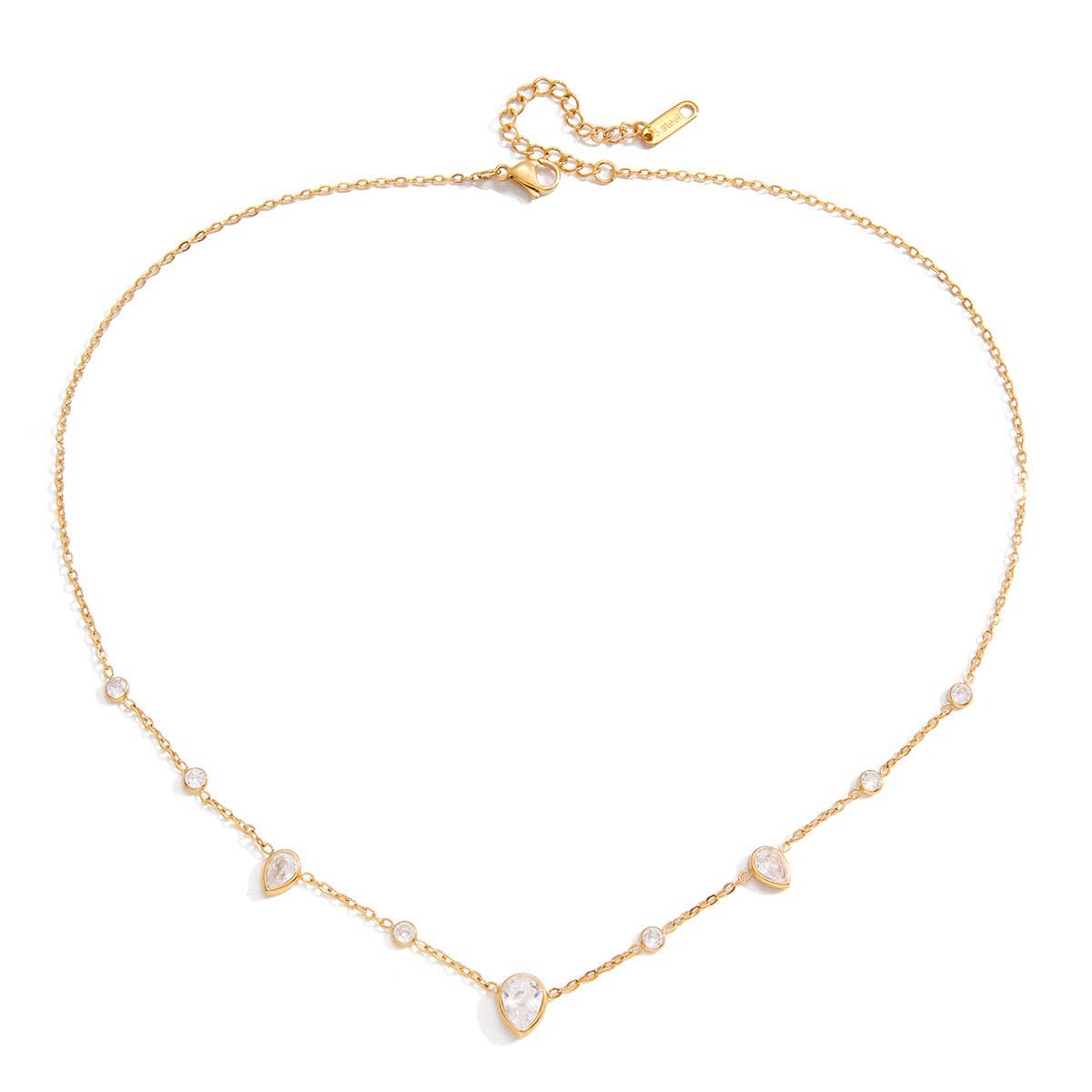 Dainty gold-tone chain necklace featuring bezel-set round and pear-shaped crystal accents spaced throughout the chain with an adjustable clasp.