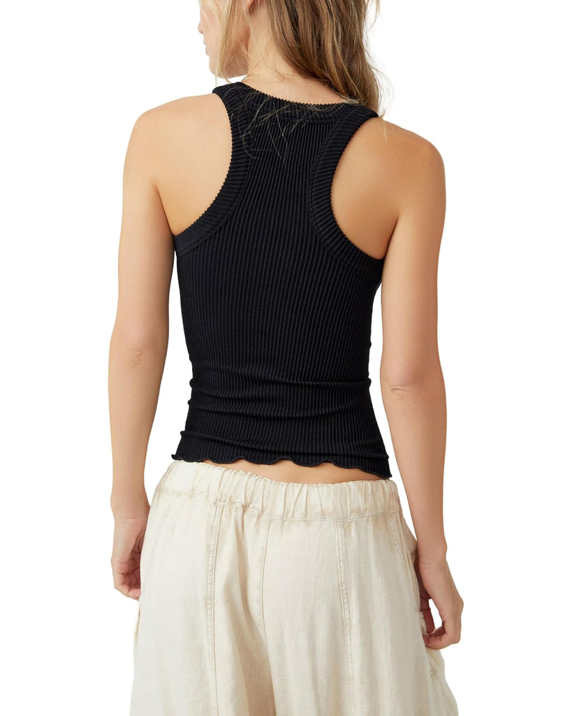 Free People Ribbed Seamless Tank Black. Crafted from soft ribbed fabric for all-day comfort and a snug fit, this Ribbed Seamless Tank serves as a comfortable base layer. Featuring a chunky trim and a racer-back style, this ribbed tank top is ideal for everyday wear.