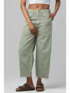 Wide leg denim jeans with a relaxed fit and vintage-inspired wash styled with a fitted top.