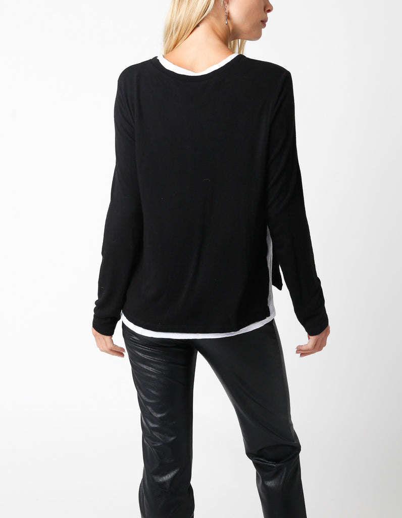 Samantha Layered Top Black White. This layered sweater top gives the illusion of a white tee under the sweater without the added bulk, perfect for wearing day or night for a quick easy look.
