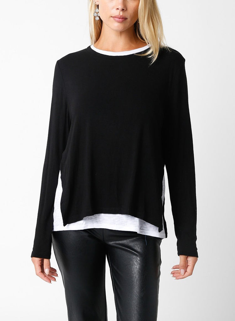Samantha Layered Top Black White. This layered sweater top gives the illusion of a white tee under the sweater without the added bulk, perfect for wearing day or night for a quick easy look.