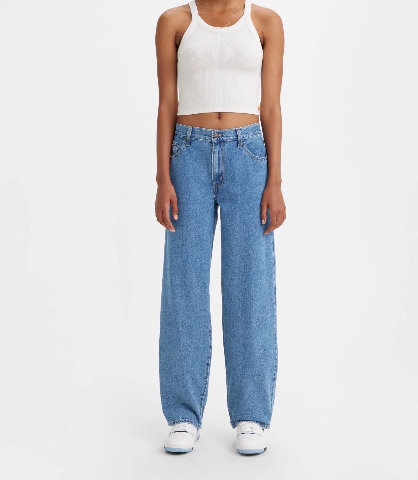 Levi Baggy Dad Jean Medium Blue Wash. The kind of jean you might steal from your dad's closet but baggier. With a mid rise and straight leg, this pair is relaxed yet flattering with extra room for a subtle edge.