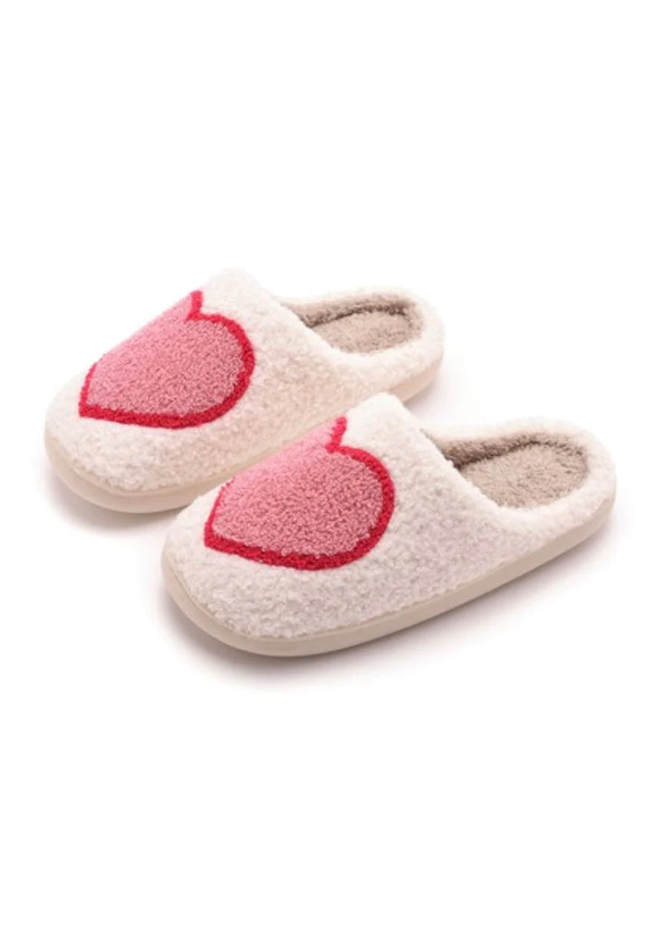 Big Heart Slippers. These adorable heart slippers are sure to keep your feet cozy and cute this season! Featuring a comfortable slip on style and cushioned sole.