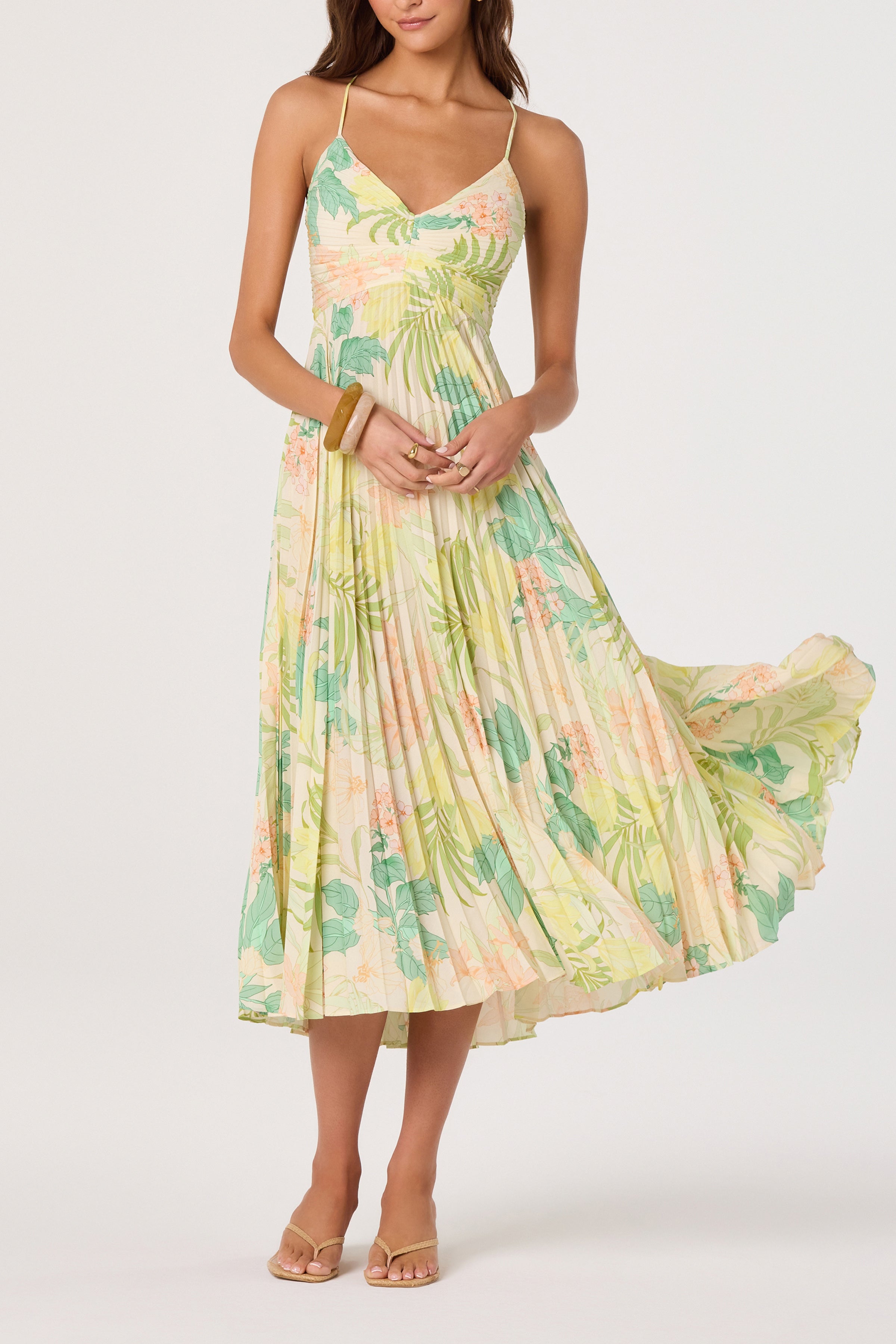 Pleated midi dress with open back, tie detail, and thin straps, shown from the back.