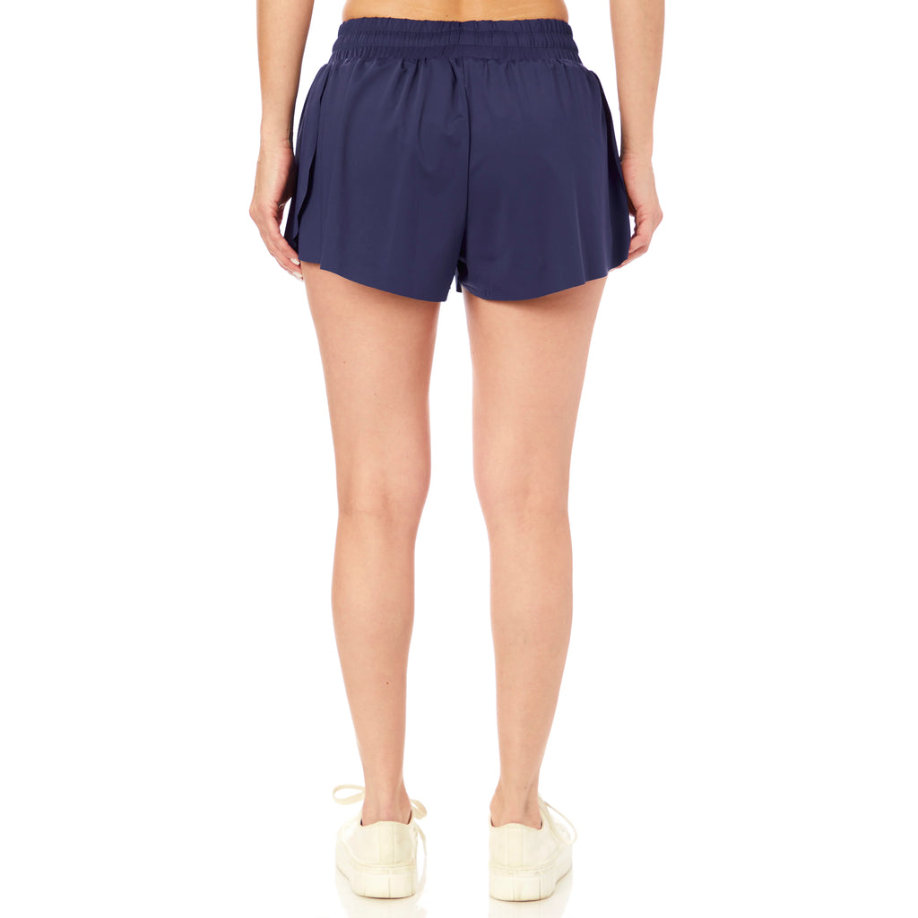 Jaclyn Running Short Navy. These lightweight running shorts feature an elastic tie waist for a comfortable fit, perfect for wearing to the gym, on a run or just out and about.