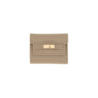 A small taupe leather wallet with a gold-tone turn-lock clasp on a plain white background.