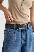 Free People Brooklyn Belt in Bitter Bark, styled on model with jeans and a ribbed top