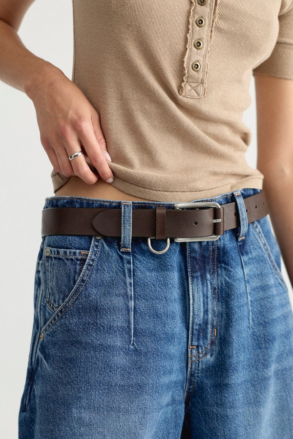 Free People Brooklyn Belt in Bitter Bark, styled on model with jeans and a ribbed top