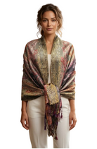 Woman wearing an oversized metallic-thread pashmina shawl with a fringed hem.