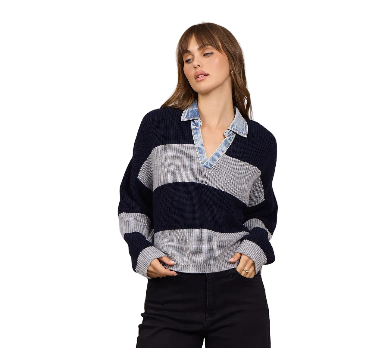 Model wearing a striped knit sweater with an attached denim collar, V-neckline, relaxed fit, and long sleeves paired with dark denim.