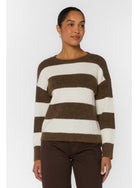 woman wearing a brown and white striped crew neck relaxed fit sweater