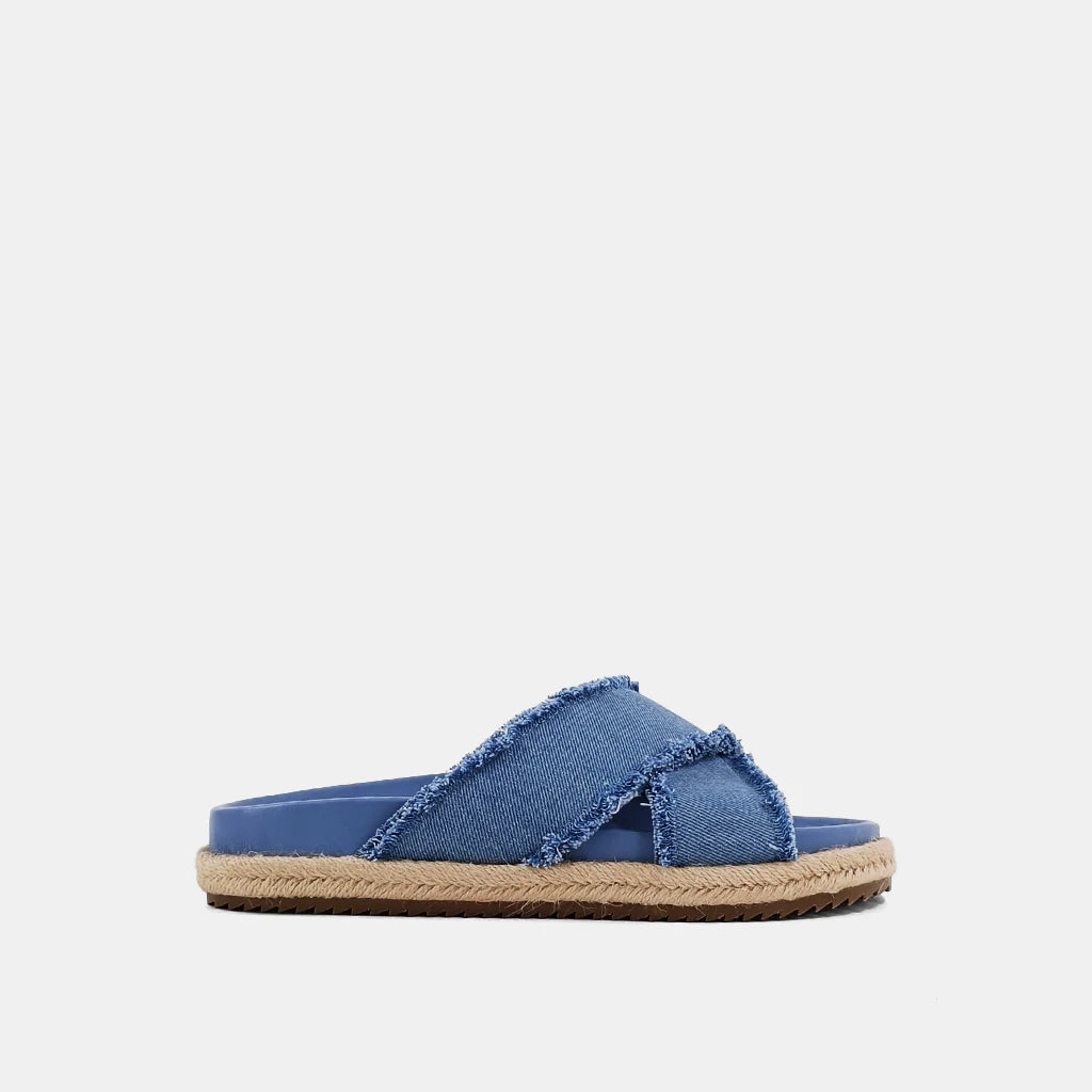 Courtney Sandal Denim. Upgrade your summer wardrobe with these slip-on sandals. Experience unparalleled comfort with its molded footbed and enjoy the stylish blue distressed denim textile fabric complementing any casual outfit. The rope-detailed outsole adds a touch of sophistication to this chic and versatile sandal