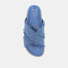 Courtney Sandal Denim. Upgrade your summer wardrobe with these slip-on sandals. Experience unparalleled comfort with its molded footbed and enjoy the stylish blue distressed denim textile fabric complementing any casual outfit. The rope-detailed outsole adds a touch of sophistication to this chic and versatile sandal.