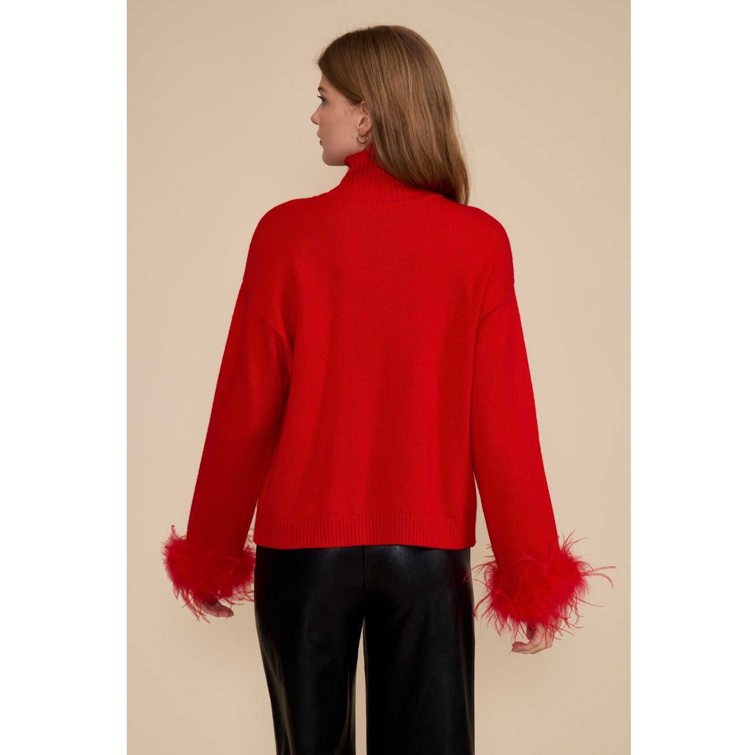 Red Clark Feather Trim Sweater with a ribbed mock neck, relaxed fit, dropped shoulders, and feather-trimmed cuffs