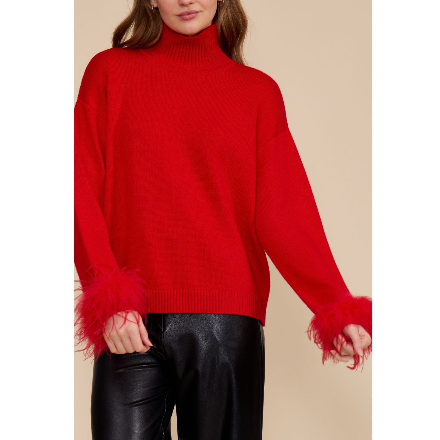 Red Clark Feather Trim Sweater with a ribbed mock neck, relaxed fit, dropped shoulders, and feather-trimmed cuffs