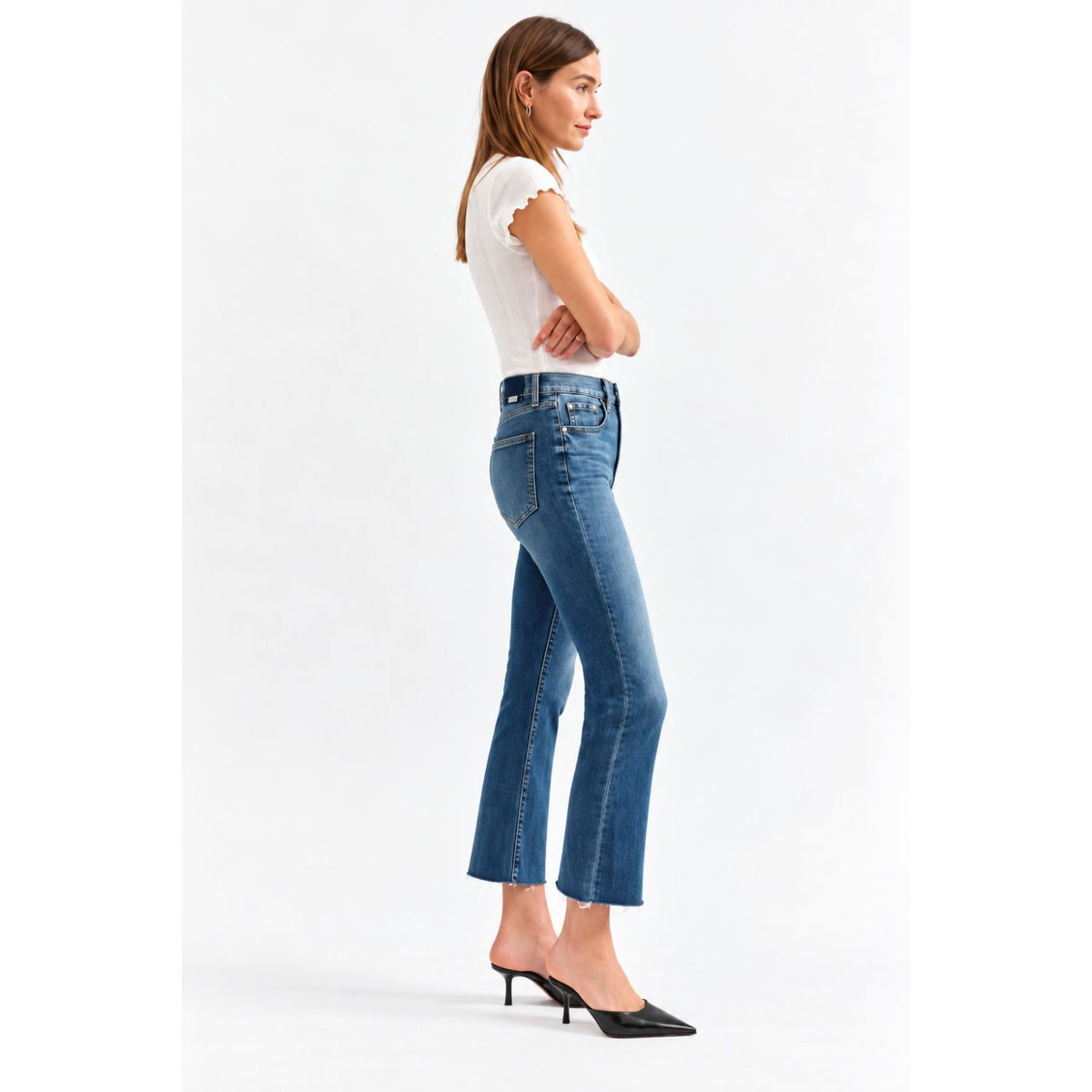 Shy Girl in Influencer Jeans featuring a deep blue wash, high-rise cropped flare silhouette, and scissor-cut hem