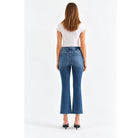 Shy Girl in Influencer Jeans featuring a deep blue wash, high-rise cropped flare silhouette, and scissor-cut hem