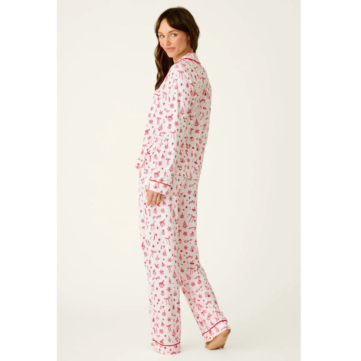 Ivory three-piece holiday pajama set with red Christmas print, button-front top, pants, and matching eye mask