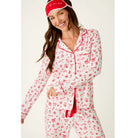 Ivory three-piece holiday pajama set with red Christmas print, button-front top, pants, and matching eye mask