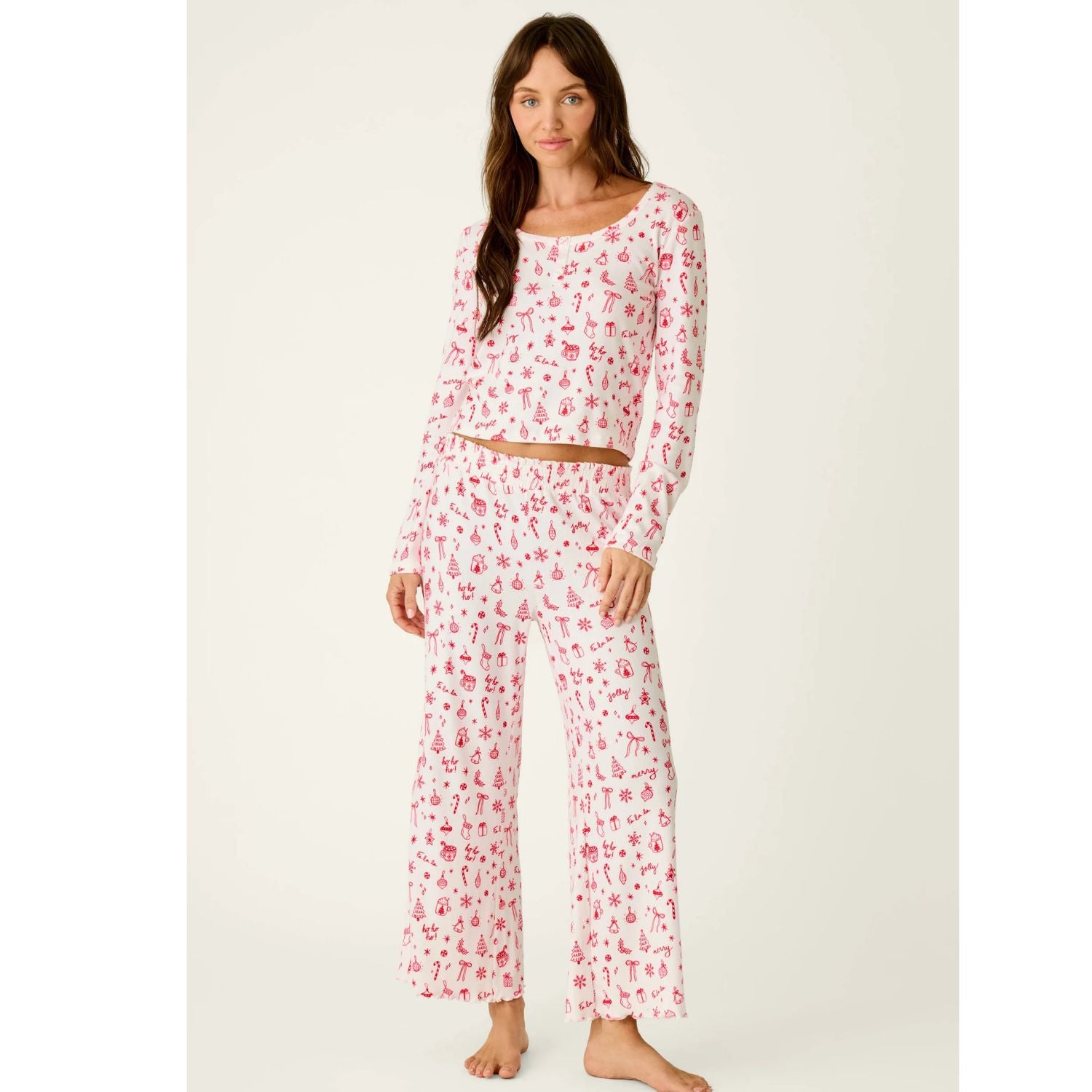 Ivory cropped pajama top with red Christmas print, scoop neckline, and long sleeves