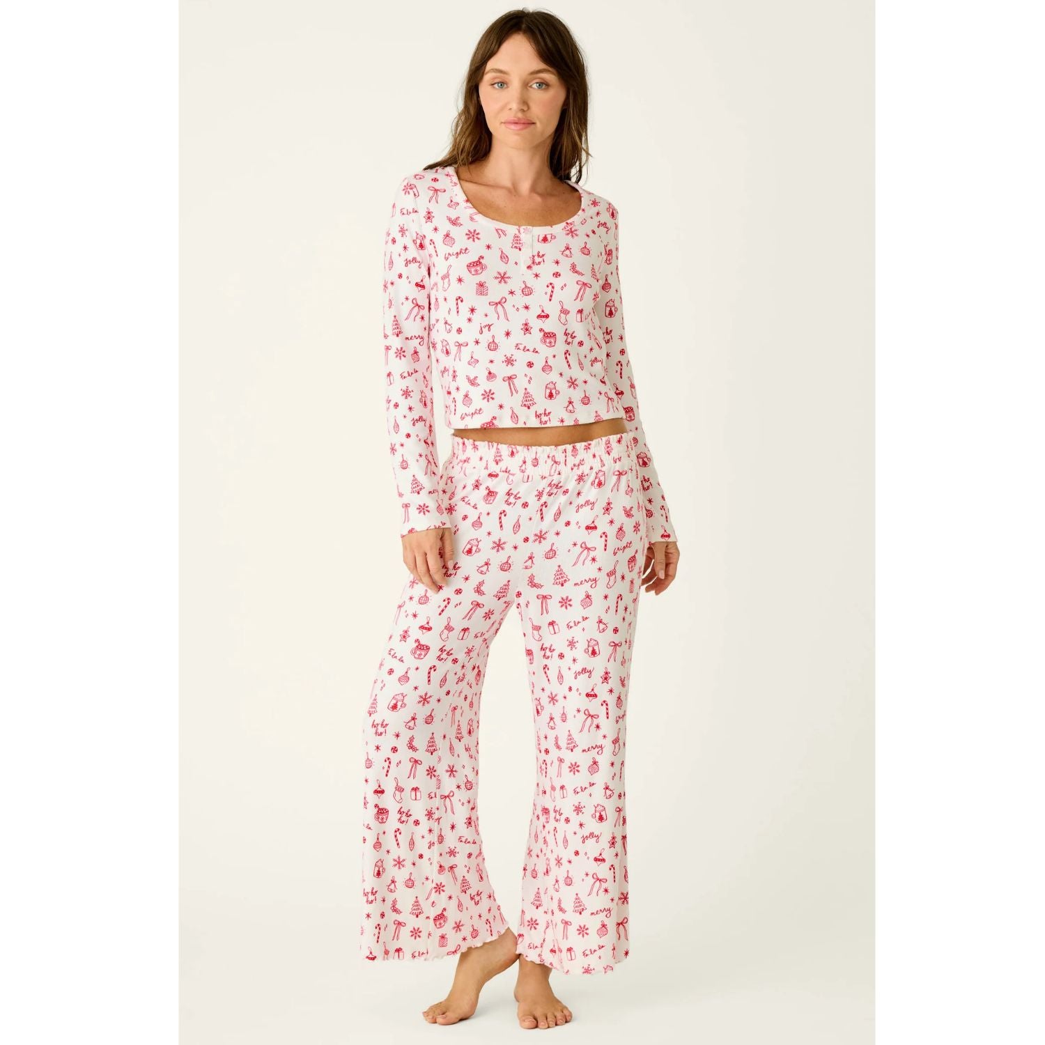 Ivory cropped pajama pants with red holiday print, smocked waistband, and open-leg silhouette
