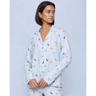 A cozy two-piece sleep set featuring brushed Pillowsoft fabric, a button-front top with contrast piping, and full-length drawstring pants for relaxing in comfort