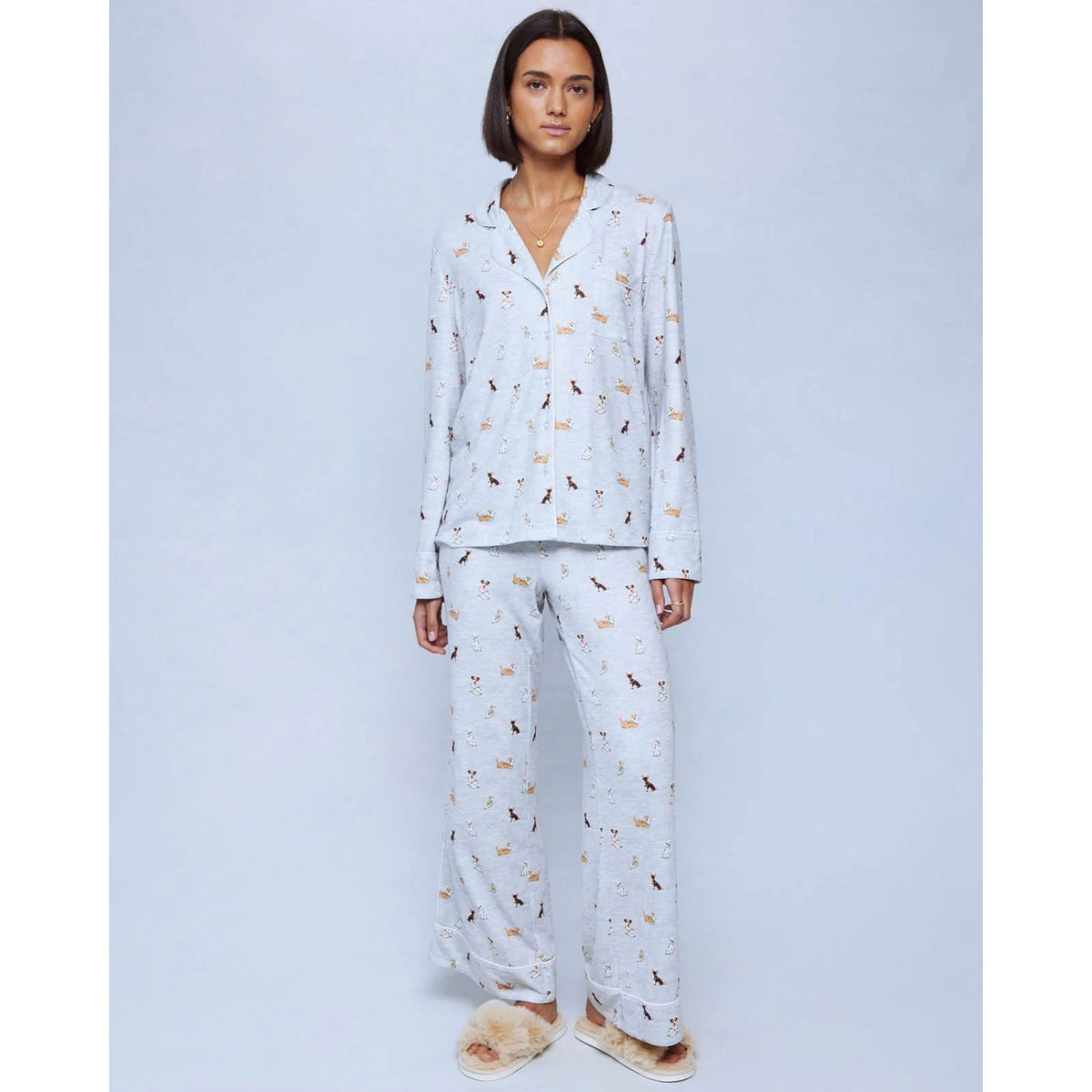 A cozy two-piece sleep set featuring brushed Pillowsoft fabric, a button-front top with contrast piping, and full-length drawstring pants for relaxing in comfort