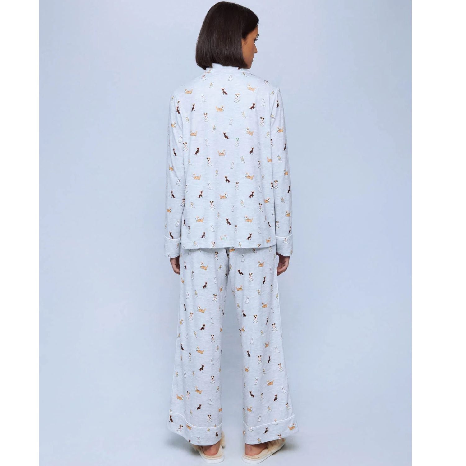 A cozy two-piece sleep set featuring brushed Pillowsoft fabric, a button-front top with contrast piping, and full-length drawstring pants for relaxing in comfort