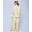 A cozy two-piece sleep set featuring brushed Pillowsoft fabric, a button-front top with contrast piping, and full-length drawstring pants for relaxing in comfort