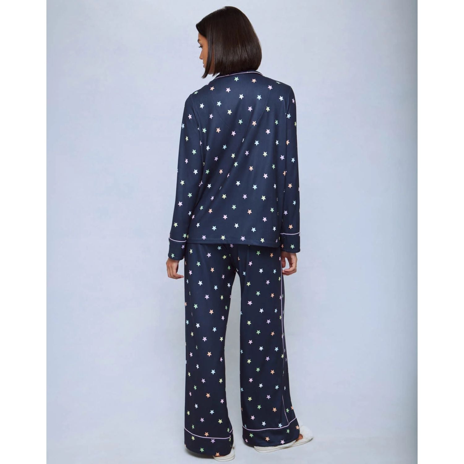 A cozy two-piece sleep set featuring brushed Pillowsoft fabric, a button-front top with contrast piping, and full-length drawstring pants for relaxing in comfort