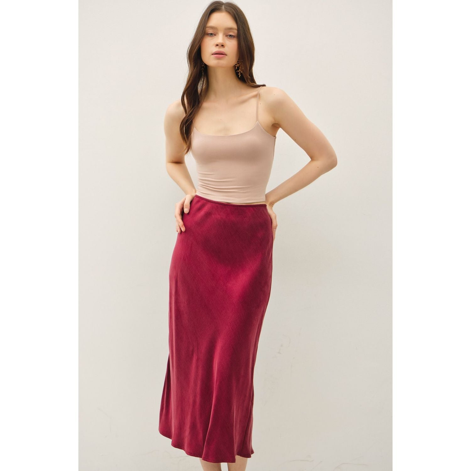 Women's suede-feel midi skirt with a high-rise elastic waistband, pull-on design, and flowing fit-and-flare silhouette