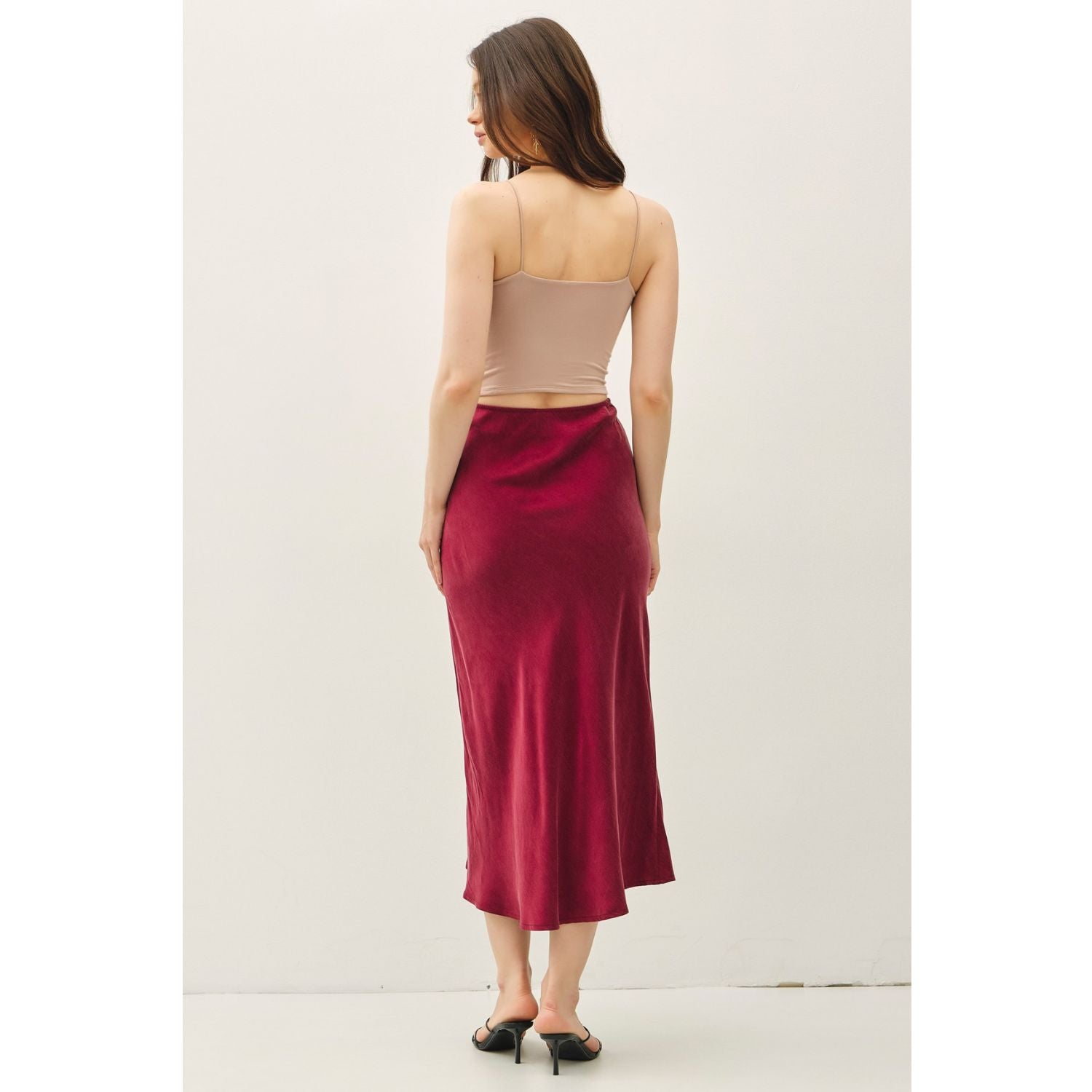 Women's suede-feel midi skirt with a high-rise elastic waistband, pull-on design, and flowing fit-and-flare silhouette