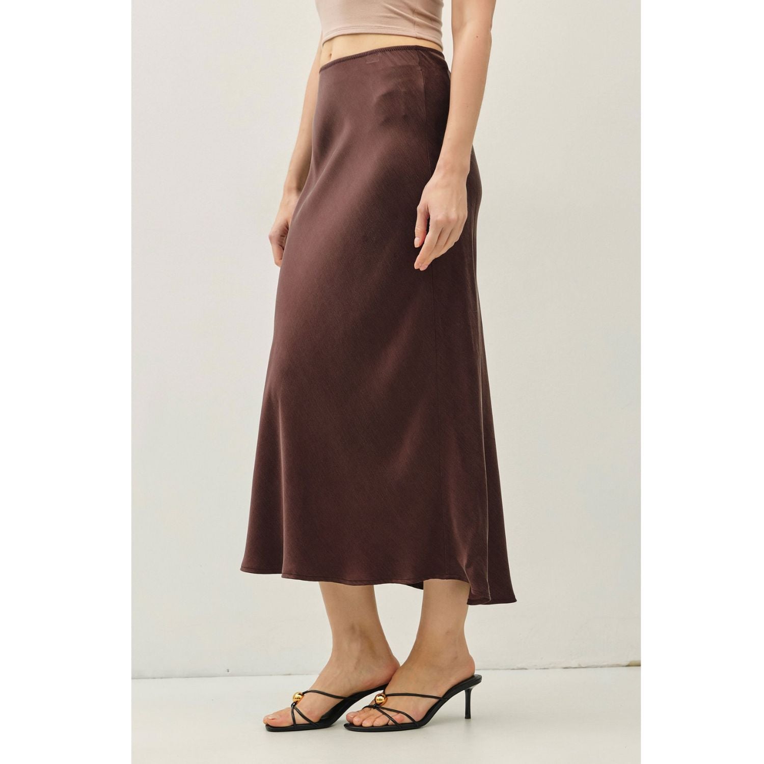 Women's suede-feel midi skirt with a high-rise elastic waistband, pull-on design, and flowing fit-and-flare silhouette