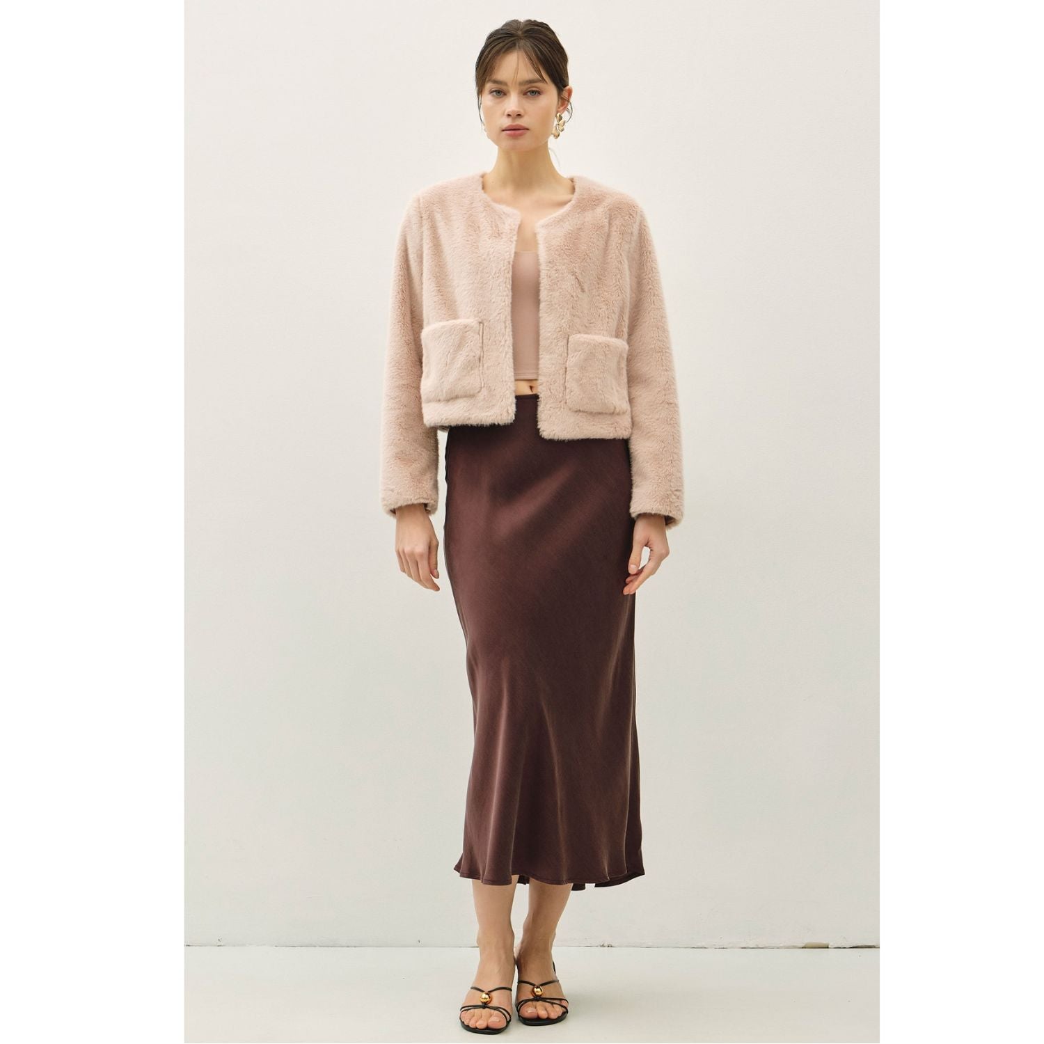 Women's suede-feel midi skirt with a high-rise elastic waistband, pull-on design, and flowing fit-and-flare silhouette