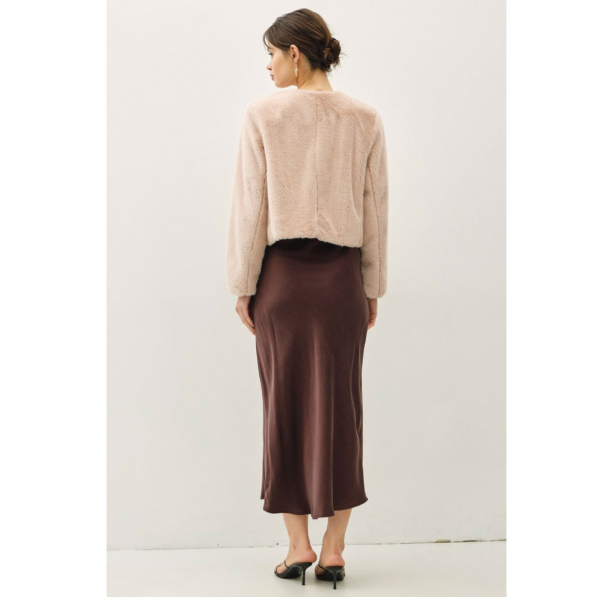 Women's suede-feel midi skirt with a high-rise elastic waistband, pull-on design, and flowing fit-and-flare silhouette