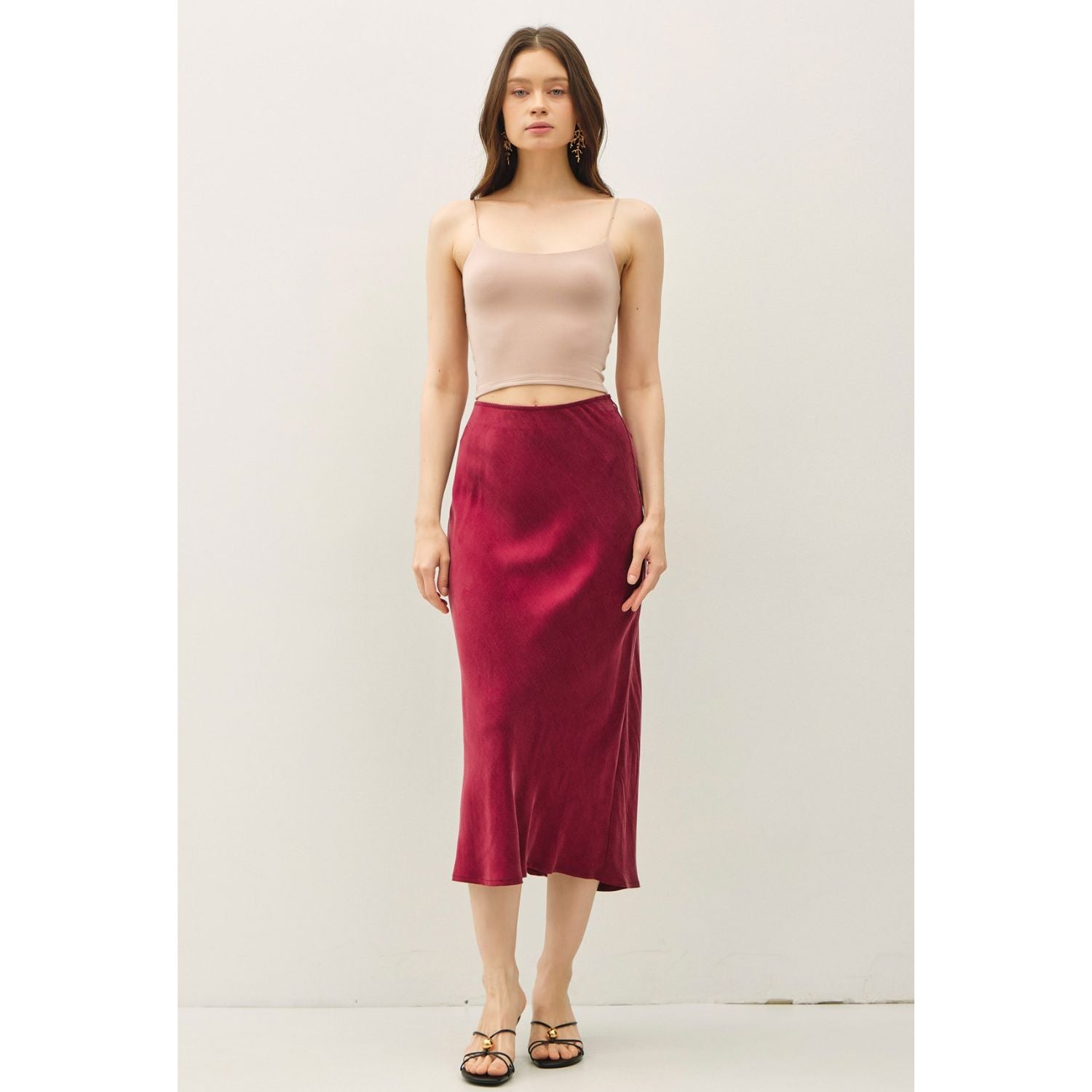 Women's suede-feel midi skirt with a high-rise elastic waistband, pull-on design, and flowing fit-and-flare silhouette