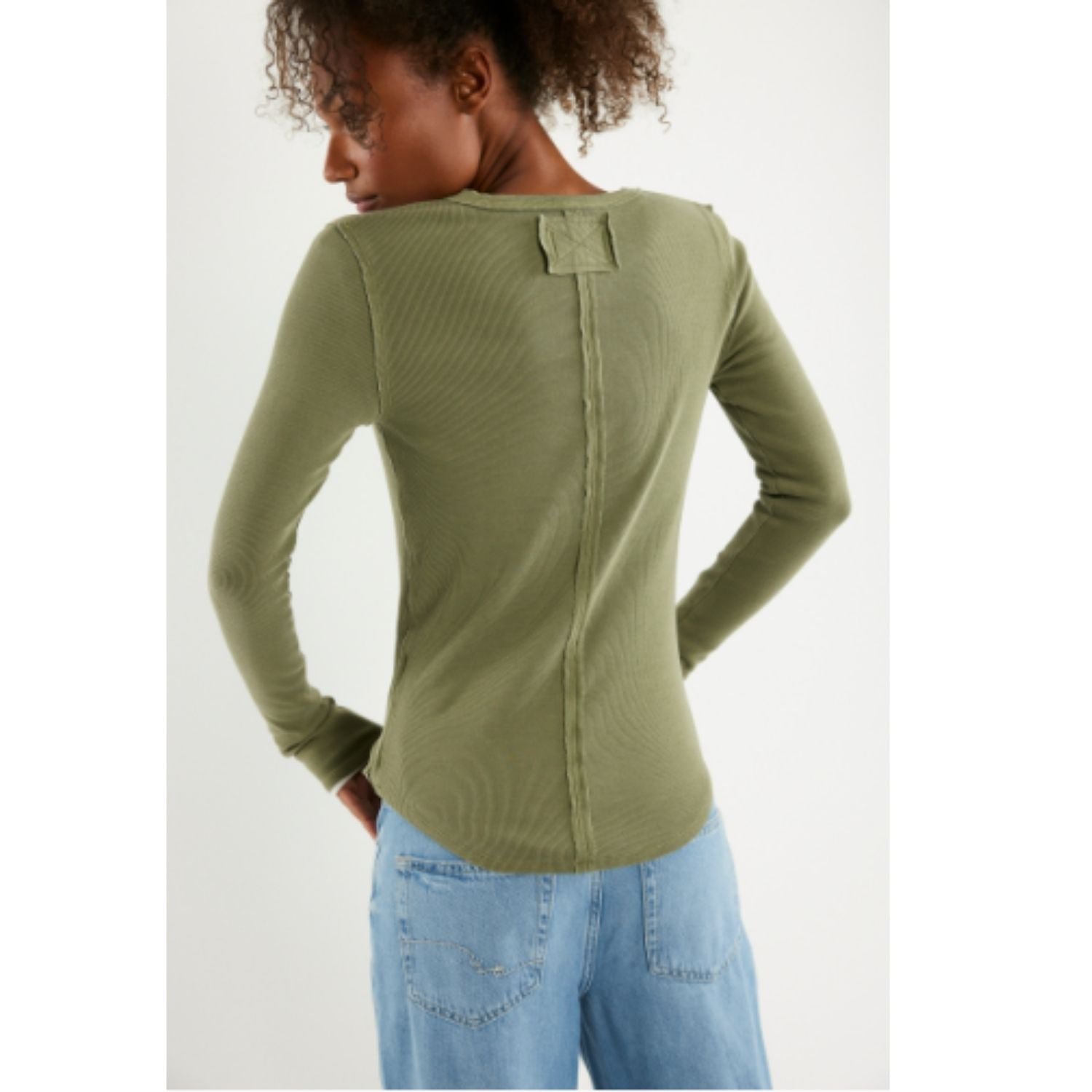 Free People Jamie Henley long-sleeve knit top featuring a slim fit, defined seams, and button-front detailing