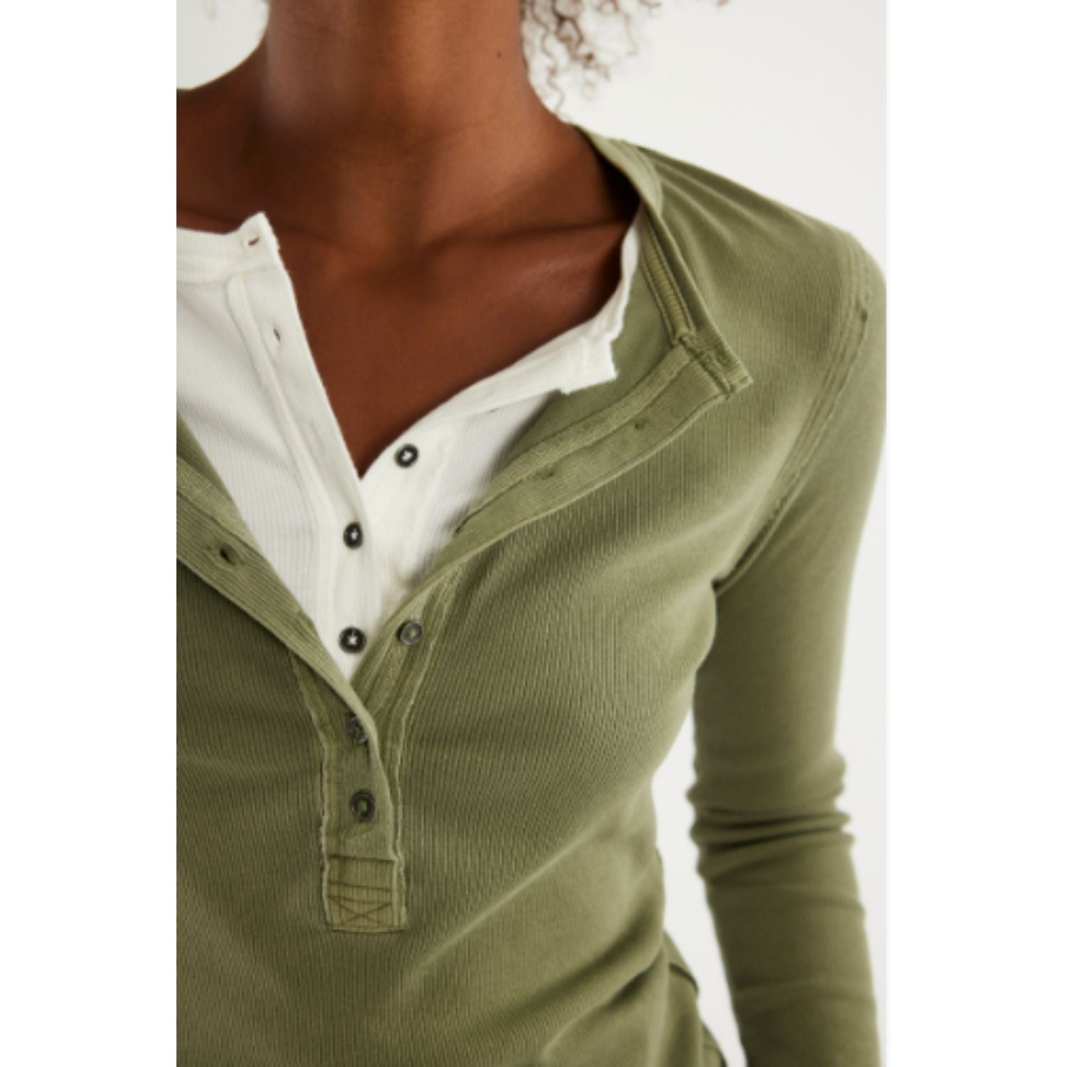 Free People Jamie Henley long-sleeve knit top featuring a slim fit, defined seams, and button-front detailing