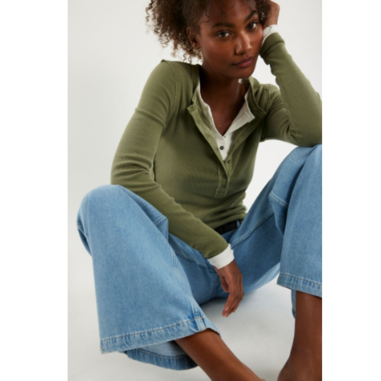 Free People Jamie Henley long-sleeve knit top featuring a slim fit, defined seams, and button-front detailing
