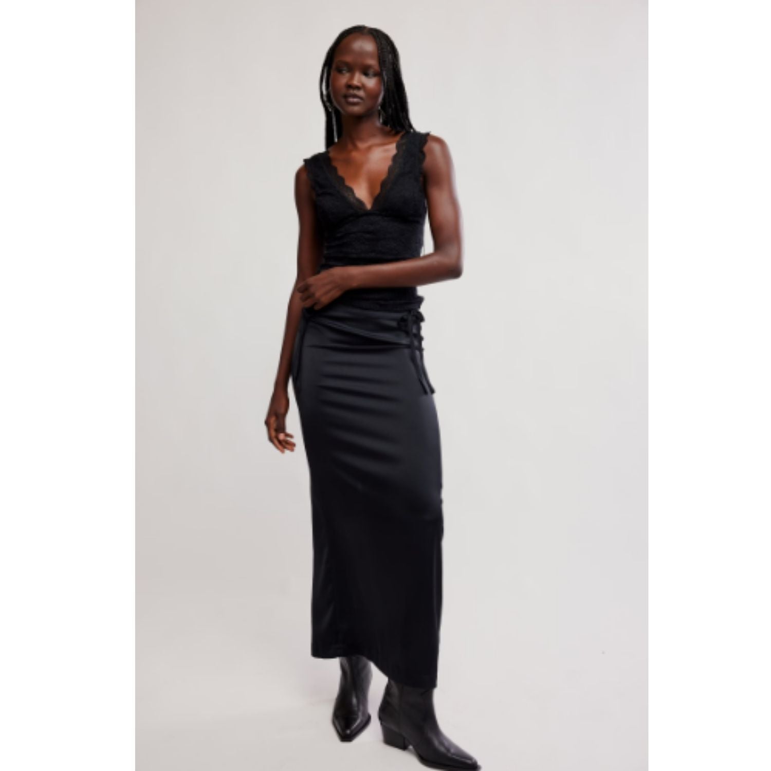 Women's lace tank top featuring a V-neckline, scalloped trim, and feminine open-back detailing