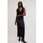 Women's lace tank top featuring a V-neckline, scalloped trim, and feminine open-back detailing