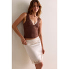Women's lace tank top featuring a V-neckline, scalloped trim, and feminine open-back detailing