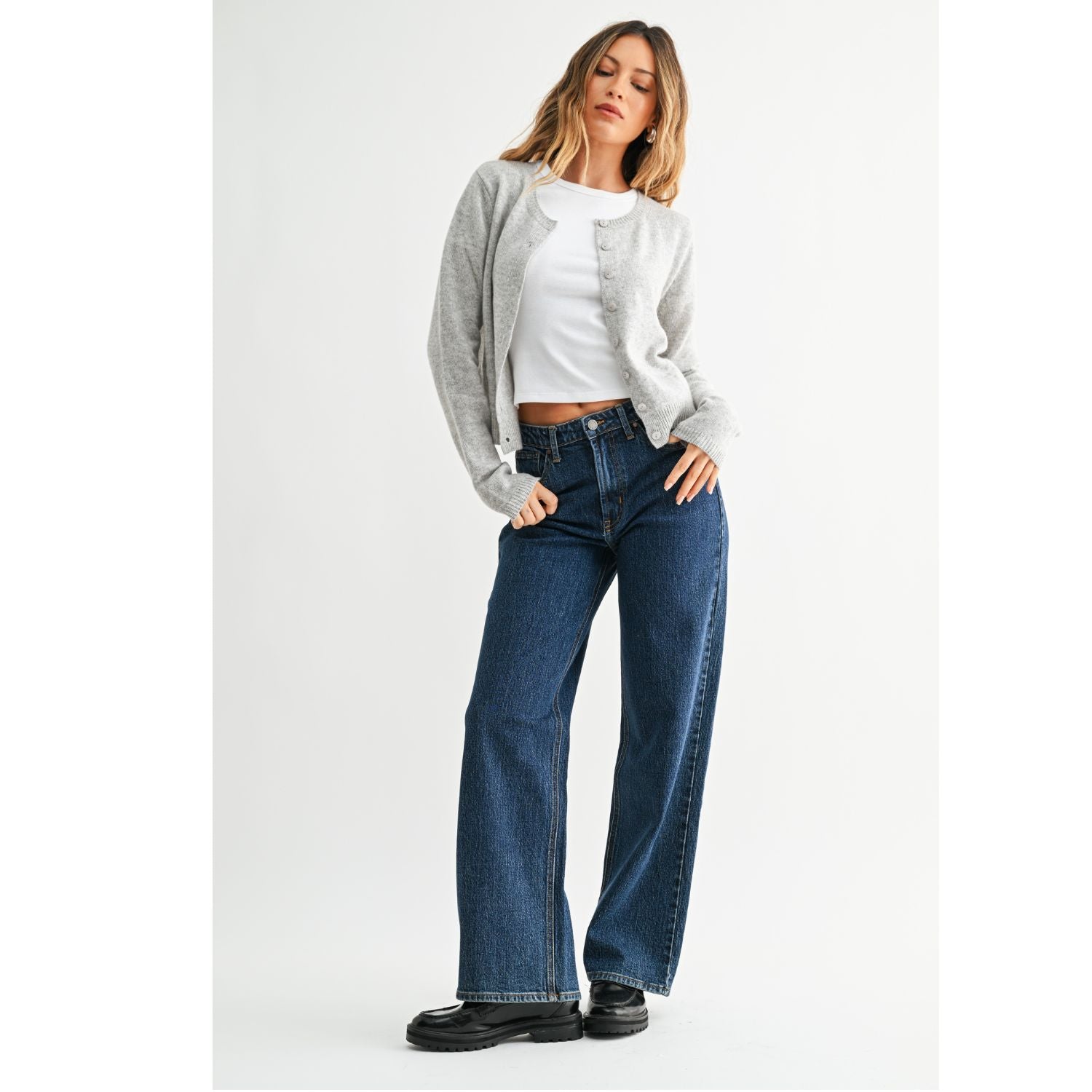 High-Rise Straight-Leg Jeans feature a flattering high-rise waist and full-length straight-leg silhouette. The rich dark denim wash creates a sleek, elongated look with a polished finish.