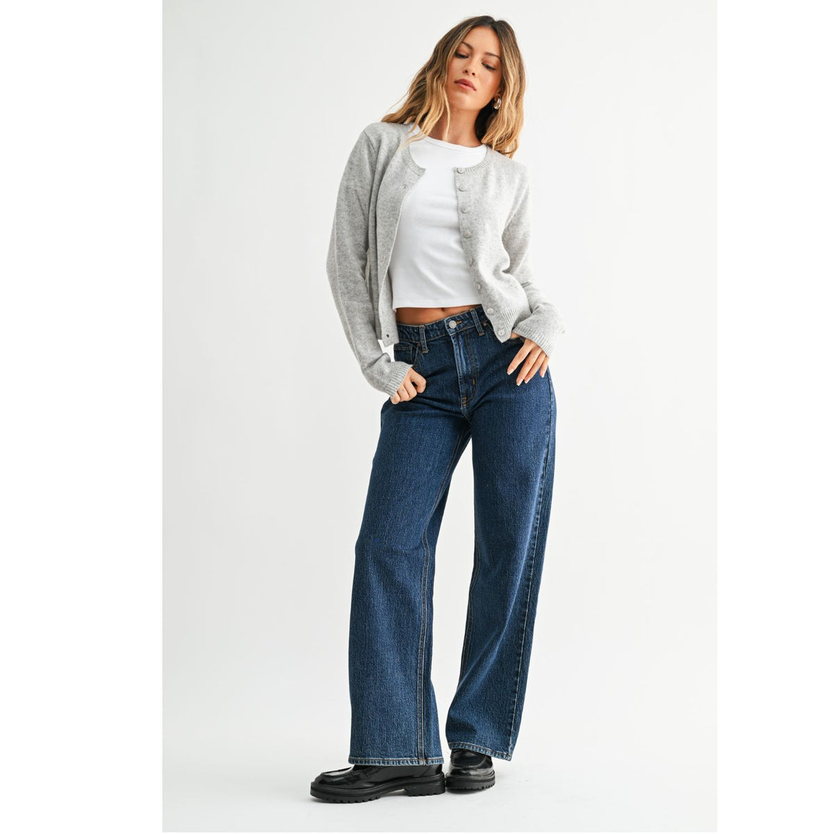 High-Rise Straight-Leg Jeans feature a flattering high-rise waist and full-length straight-leg silhouette. The rich dark denim wash creates a sleek, elongated look with a polished finish.
