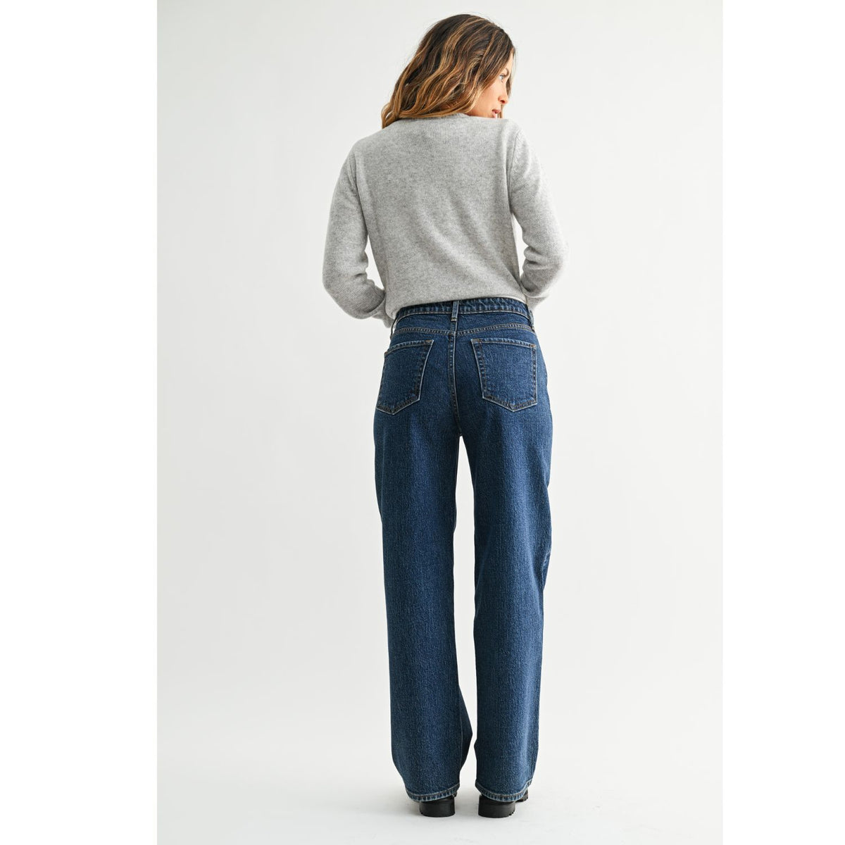 High-Rise Straight-Leg Jeans feature a flattering high-rise waist and full-length straight-leg silhouette. The rich dark denim wash creates a sleek, elongated look with a polished finish.