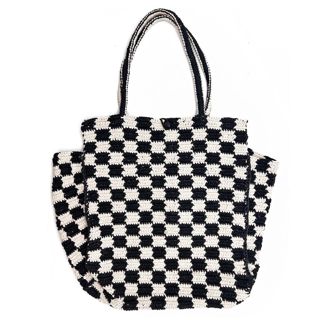 Woven Checkered Tote Bag Black White. Embrace the woven look with this checkered cotton delight that brings comfort to style. The relaxed yet trendy design makes it a go-to choice for both casual outings and more polished affairs. Let the checkered pattern be your signature of laid-back sophistication.