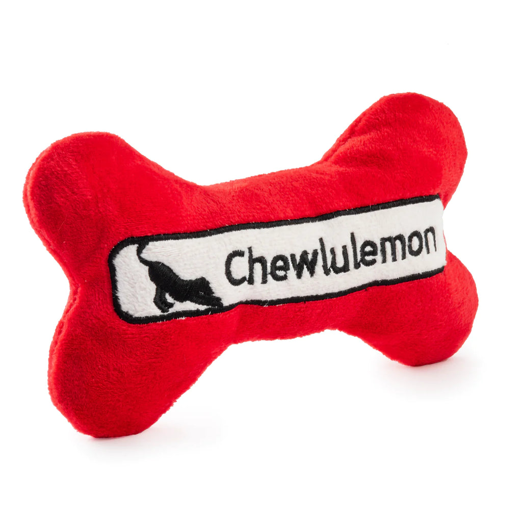 Chewlulemon Bone Plush Dog Toy Red. Elevate your dog's playtime with the Chewlulemon Bone Plush Dog Toy. This playful parody is tailored for dog owners who are passionate about yoga. Crafted with soft and durable plush material, this toy is perfect for cuddling and interactive play. The built-in squeaker adds an element of excitement.