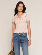Short sleeve knit polo top with embroidered detail and button neckline